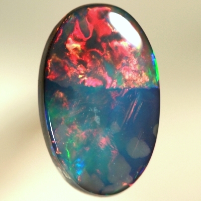SOLID BLACK OPAL Top quality. Rolling flashes of cherry red and magenta, bright green and purple. SEE VIDEO